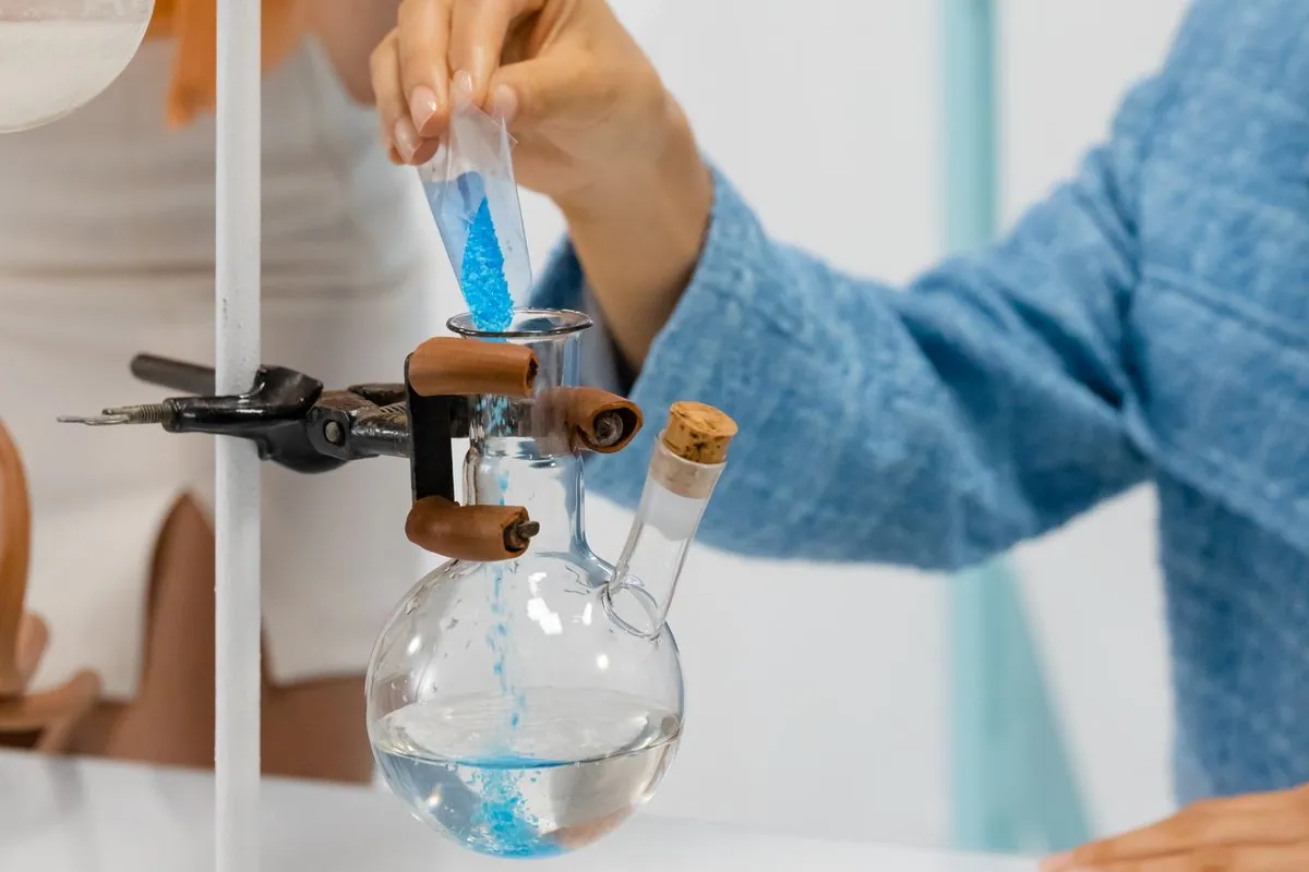 Laboratory glassware and blue crystalline material
