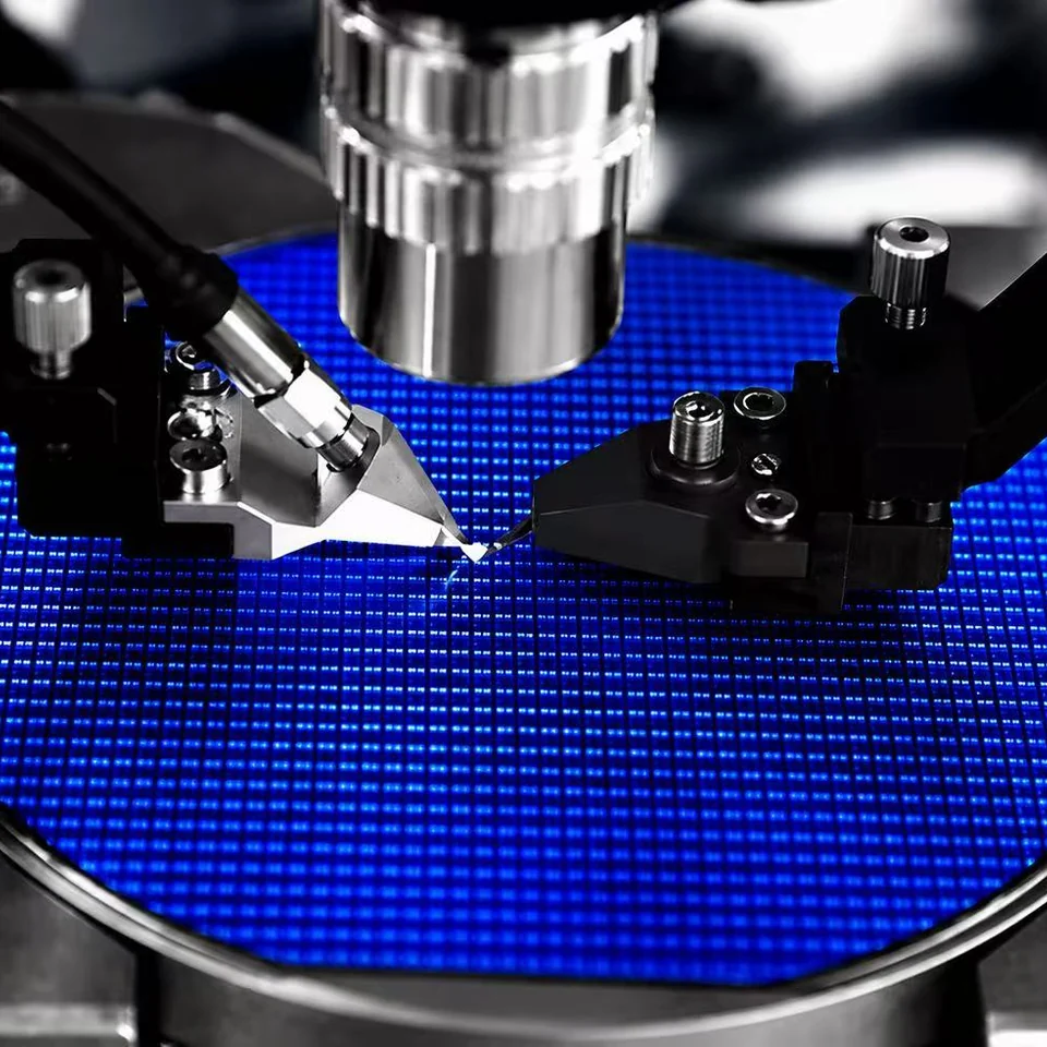 Precision probes working over a blue semiconductor wafer