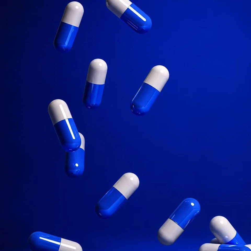 Blue and white pharmaceutical capsules